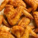 Crispy whole chicken wings roasted to golden brown with seasoning